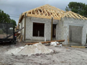 House made of cinderblocks and wood beams for roof under construction in south Florida